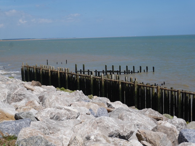 Stone and wooden sea defences at East Lane